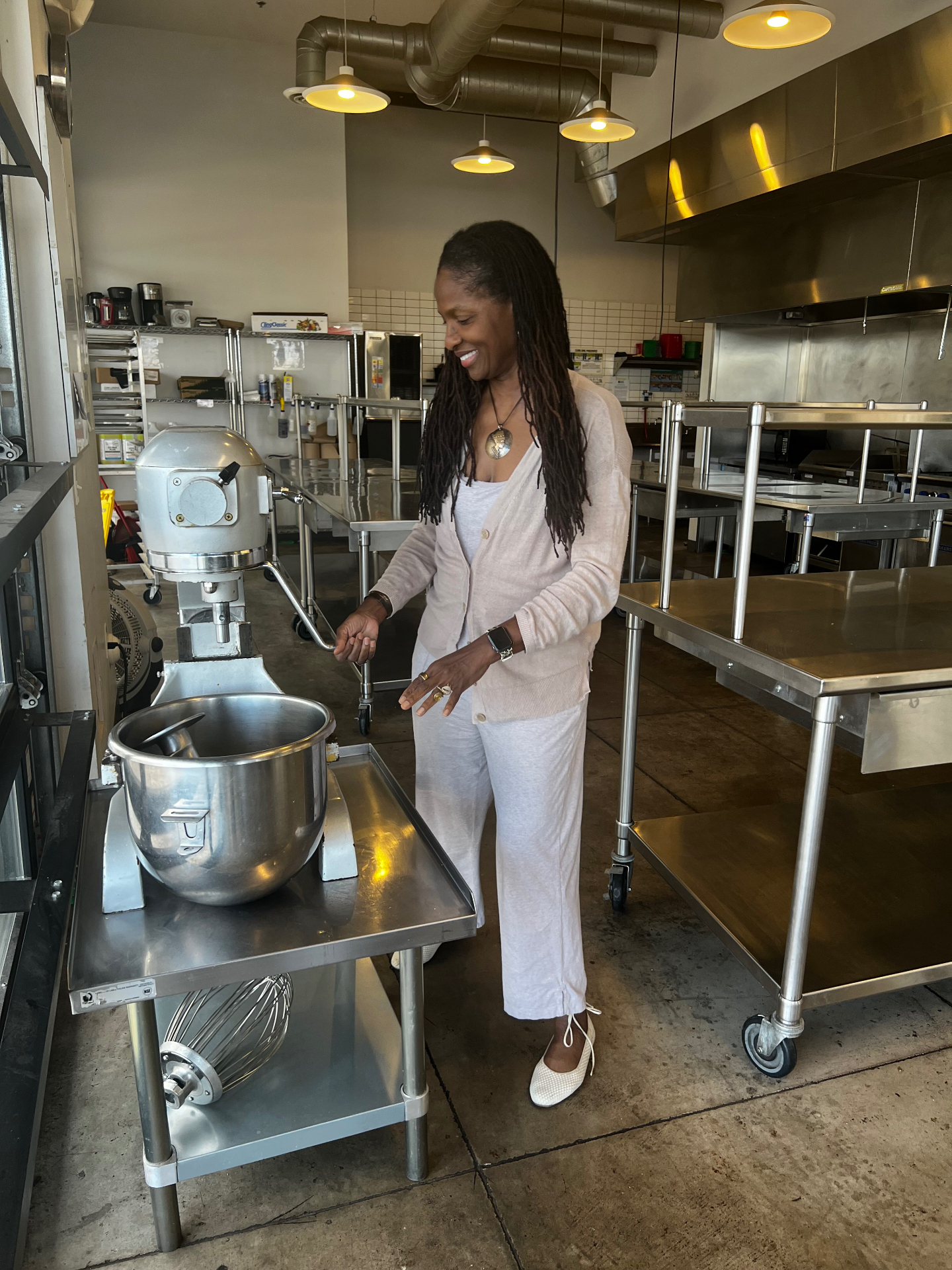 Dr. Michelle crafting products in a commercial kitchen